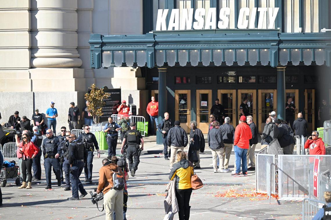 Fans clear the area around the Kansas City Chiefs’ Super Bowl victory rally after shots were fired near Union Station.