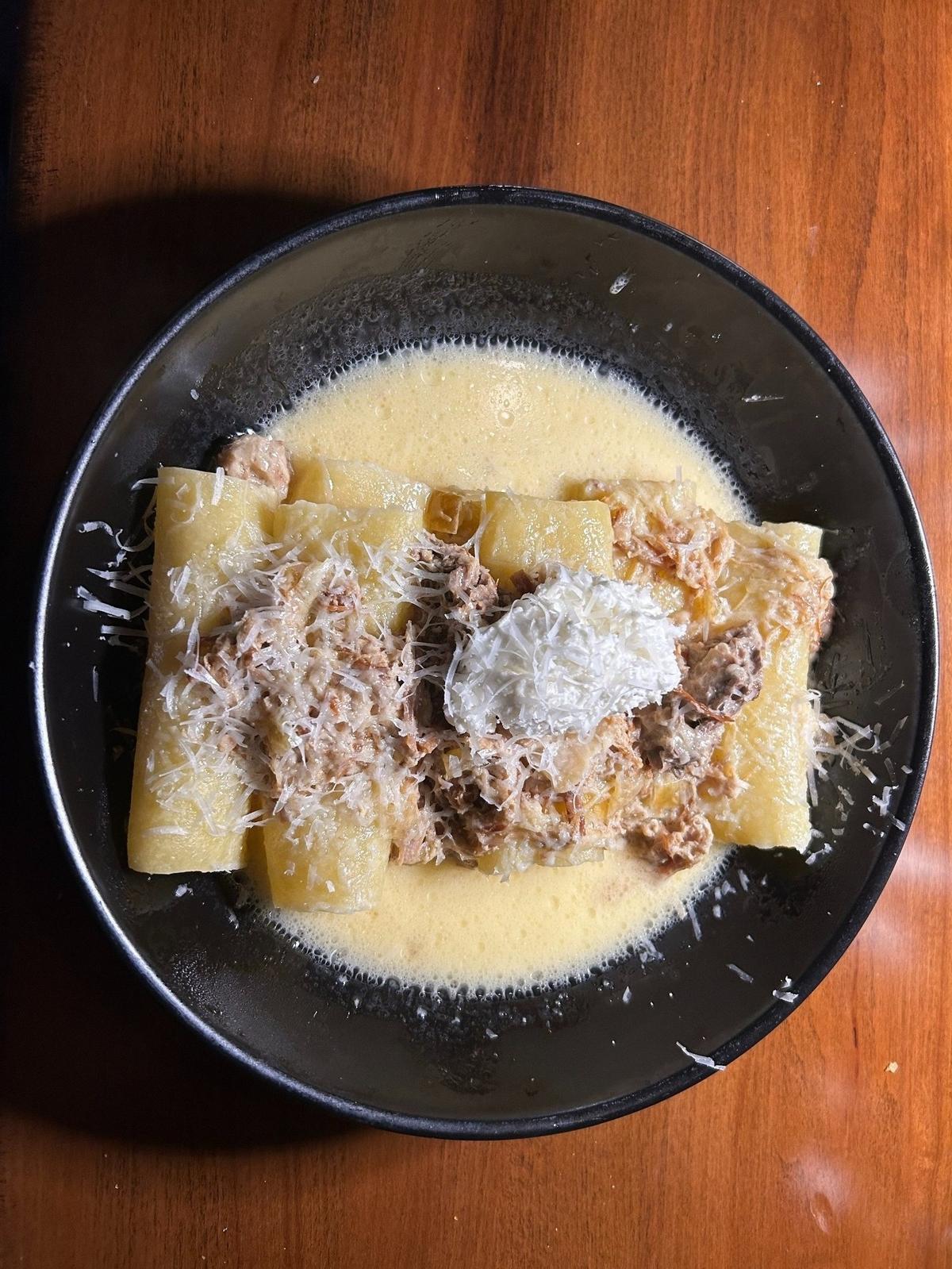 Braised pork ziti, served with heritage pork butt, caramelized onions, sweet cream, topped with ricotta made up the main course at EMI on a recent Saturday.