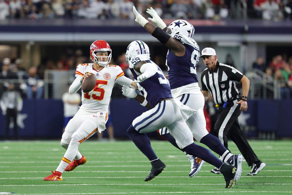 Kansas City Chiefs quarterback Patrick Mahomes looks to pass during an NFL Week 13 Thanksgiving Day game against the Dallas Cowboys at AT&T Stadium in Arlington, Texas on Thursday, Nov. 27, 2025.