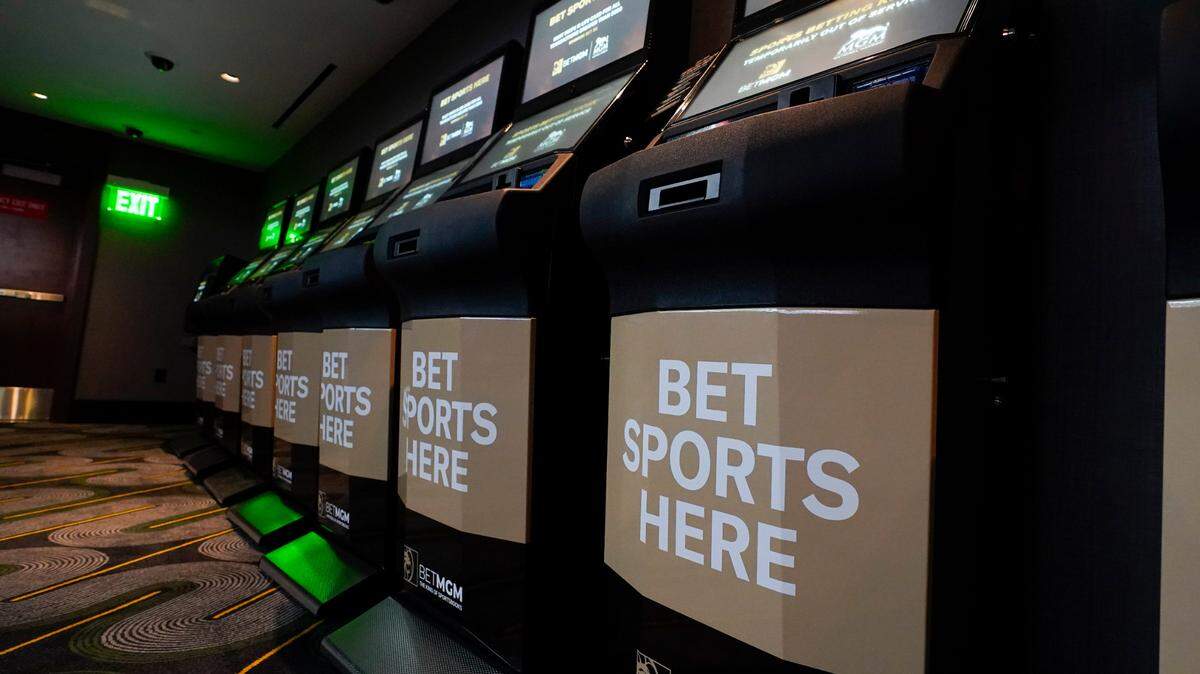 Betting kiosks are seen at the new MGM National Harbor sportsbook, Thursday, Dec. 9, 2021, in Oxon Hill, Maryland. Kansas officially starts legal sports betting Thursday.