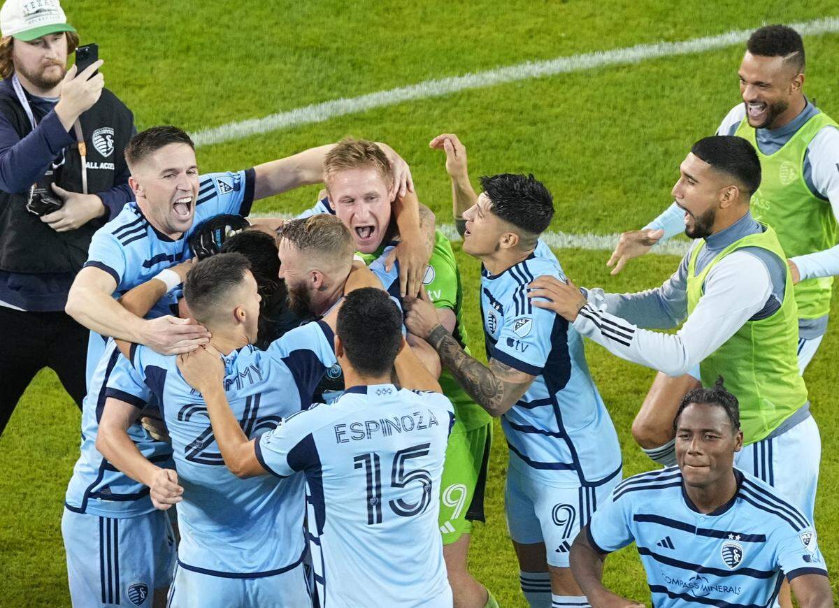 Sporting Kansas City players celebrate after defeating the San Jose Earthquakes via penalty kicks in Wednesday night’s Western Conference Wild Card match at Children’s Mercy Park.
