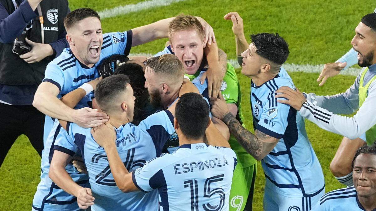 Sporting Kansas City players celebrate after defeating the San Jose Earthquakes via penalty kicks in Wednesday night’s Western Conference Wild Card match at Children’s Mercy Park.