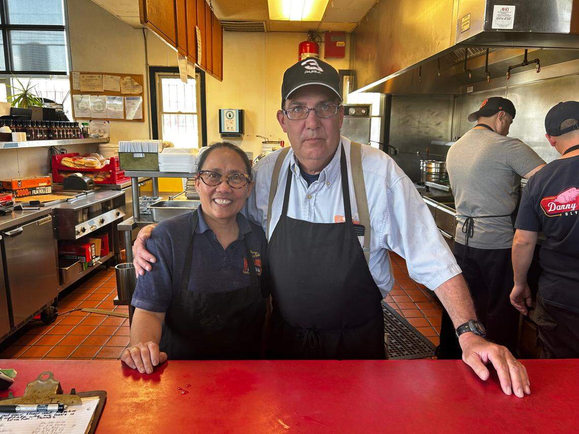 Joel Bremer, right, purchased Danny Edwards Blvd BBQ in 2018. He and his wife, Susan, are closing the location at the end of May.