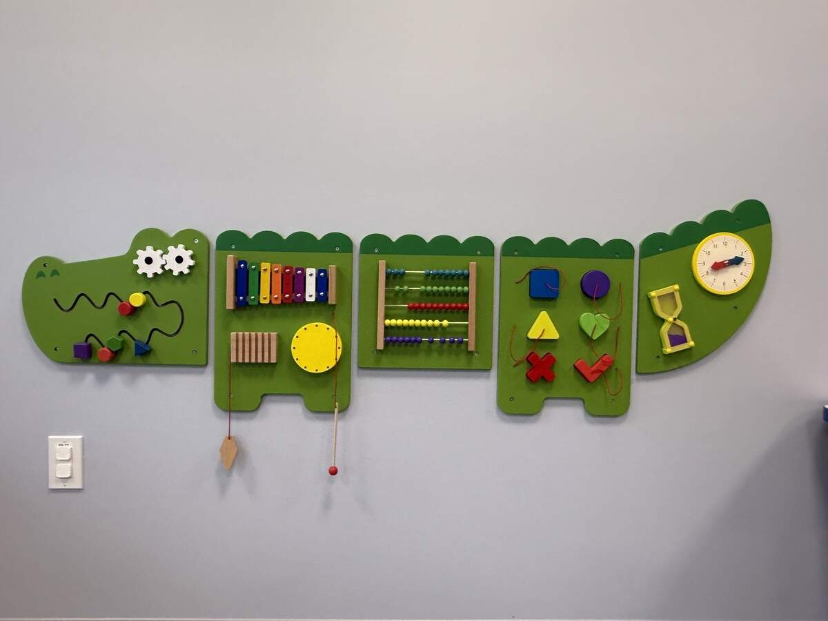 A crocodile themed toy designed to help children build motor skills is seen at Caravel Autism Health in Olathe.