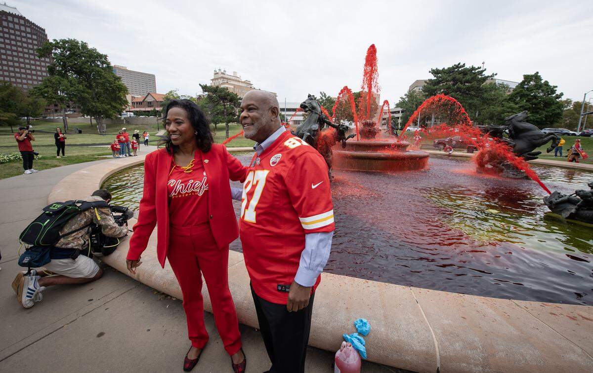 Kansas City Mayor Pro Tem Ryana Parks-Shaw, left, and 5th District Councilman at large, Darrell Curls, posed in front of the Mill Creek Park fountain shortly after they helped dump red dye in it for the kick of Red Friday ceremonies on Friday, Sept. 5, 2024, in Kansas City.