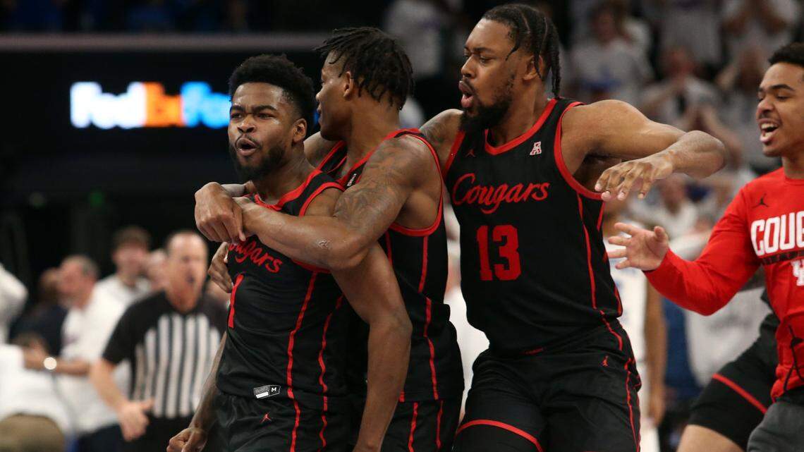 Houston Cougars guard Marcus Sasser (middle) and forward J’Wan Roberts (right) react after guard Jamal Shead (left) scored the game winning basket against the Memphis Tigers at FedExForum on March 5, 2023.