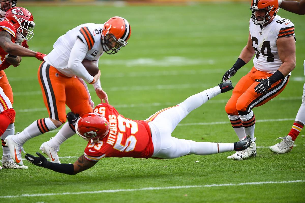 Kansas City Chiefs middle linebacker Anthony Hitchens grabs the legs of Cleveland Browns quarterback Baker Mayfield before Mayfield was sacked by cornerback L’Jarius Sneed in the first quarter Sunday, January 17, 2021, at Arrowhead Stadium in Kansas City, Missouri.