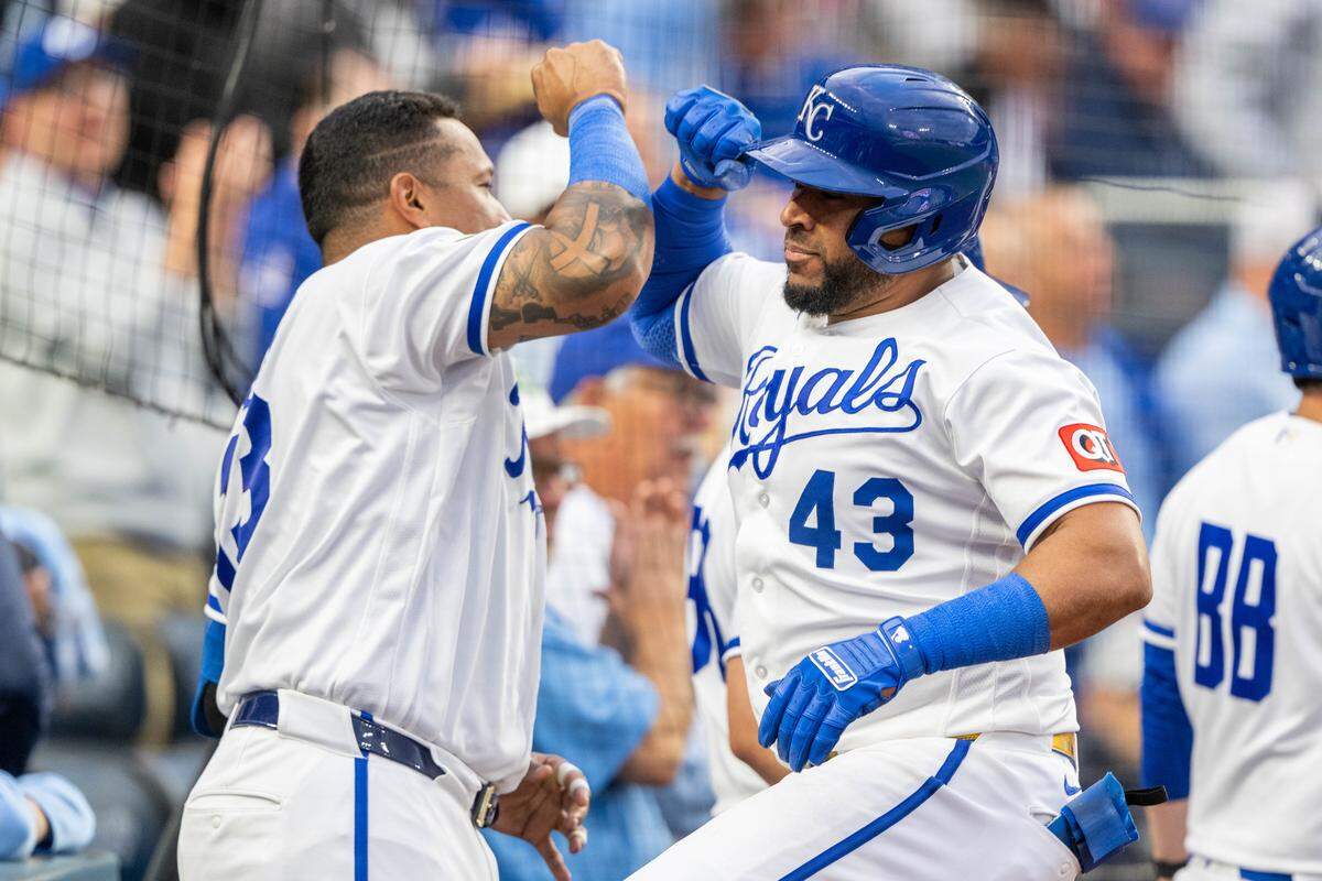 Kansas City Royals catcher Elias Díaz (No. 43) bumps forearms with teammate Salvador Perez, left, after hitting a home run against the Boston Red Sox on Wednesday, May 20, 2026, at Kauffman Stadium.