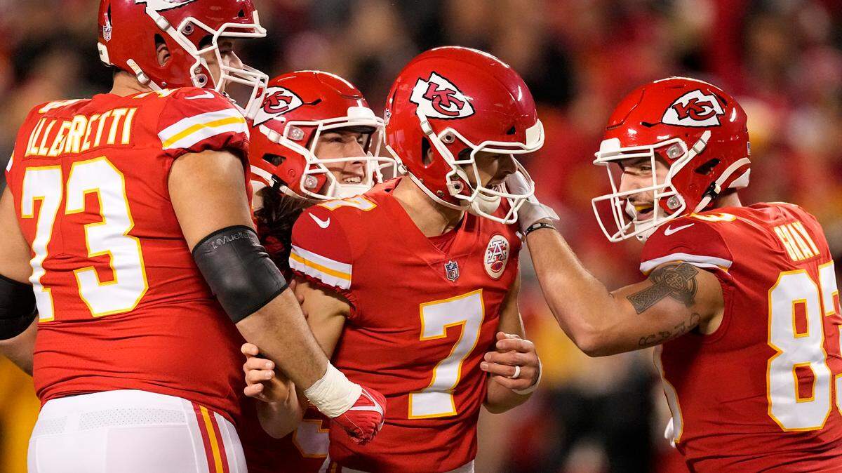 Kansas City Chiefs place kicker Harrison Butker (7) is congratulated by teammates after kicking a 56-yard field goal during the first half of an NFL football game against the Denver Broncos Sunday, Dec. 5, 2021, in Kansas City, Mo. (AP Photo/Charlie Riedel)