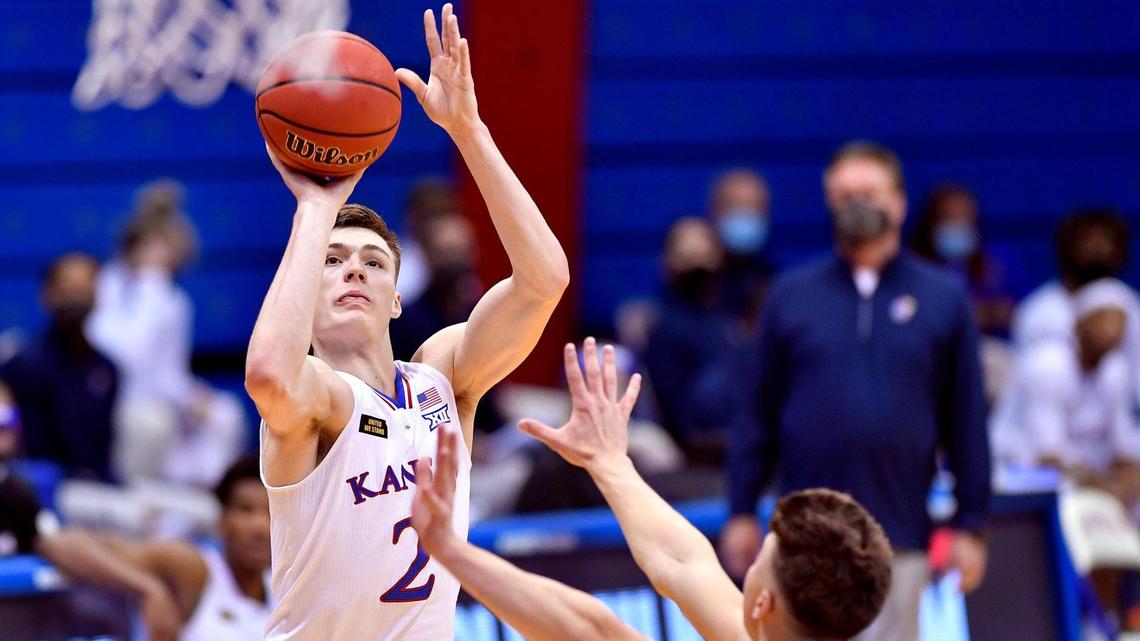 Christian Braun, left, is a returning starter on KU’s basketball team in 2021-22. It’s a team picked to earn a No. 1 seed in the NCAAs.