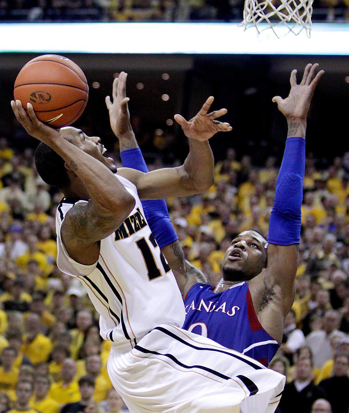MU’s Marcus Denmon hit this basket over KU’s Thomas Robinson late in the Tigers’ 74-71 win on Feb. 4, 2012 at Mizzou Arena in Columbia.