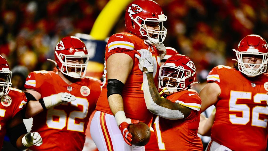 Kansas City Chiefs guard Nick Allegretti celebrates with teammates after catching a pass for a touchdown against the Pittsburgh Steelers in the third quarter Sunday, January 16, 2022, at Arrowhead Stadium.