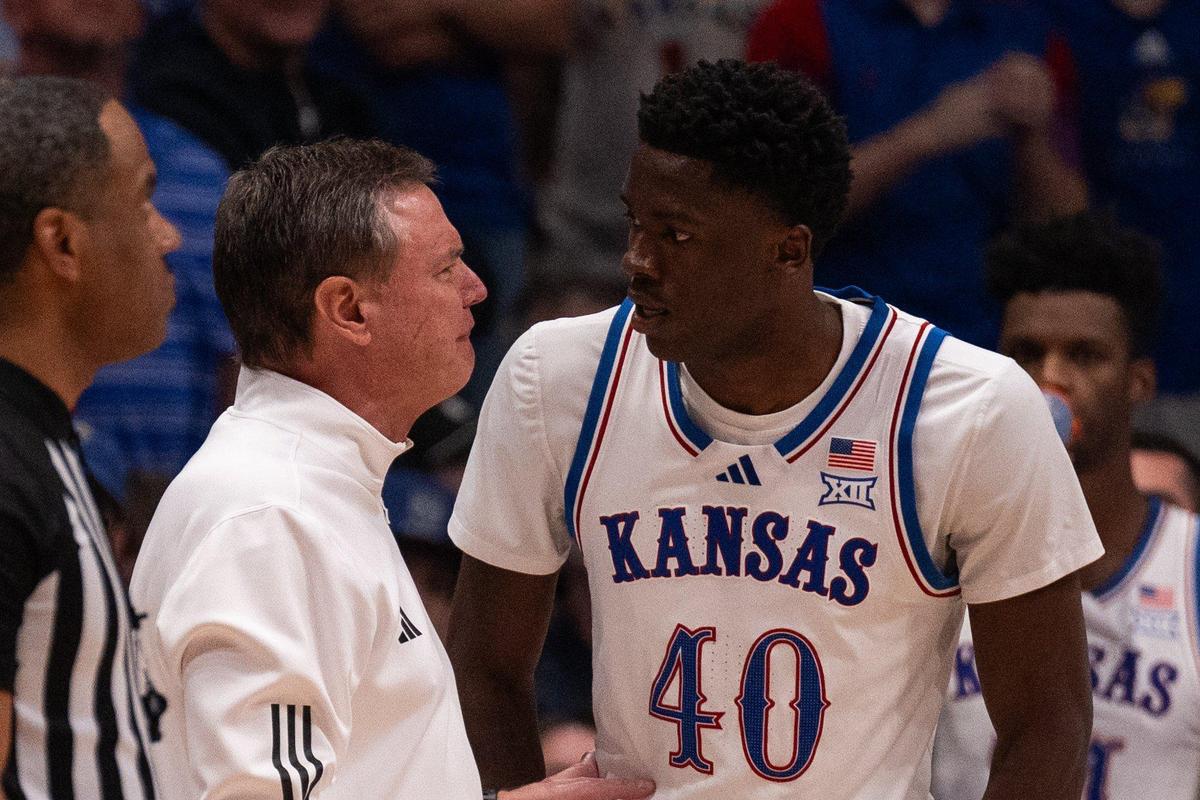 Kansas Jayhawks coach Bill Self chats with freshman forward Flory Bidunga during a men’s basketball showdown against North Carolina at Allen Fieldhouse in Lawrence, Kan., on Friday, Nov. 8, 2024.