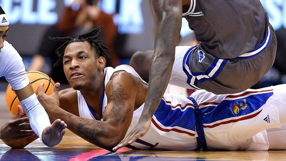KU freshman MJ Rice dives after a loose ball against Seton Hall in a game at Allen Fieldhouse.
