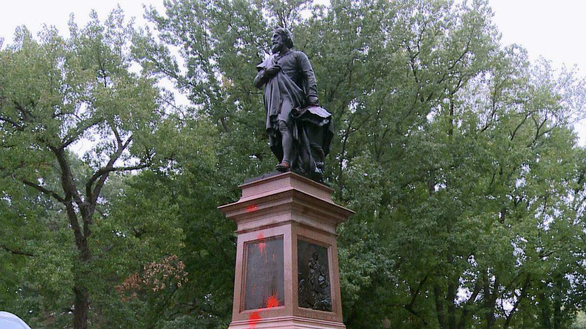 This Thursday, Oct. 12, 2017, photo from video by KSDK-TV shows the Christopher Columbus statue in Tower Grove Park in St. Louis after red paint was used to vandalize the statue. The statue was also vandalized in October 2016.