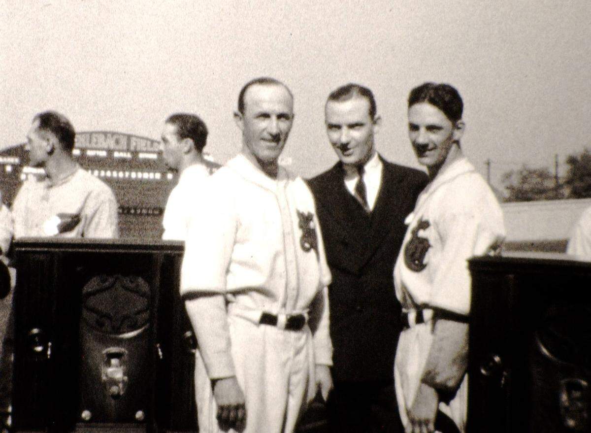 In a scene from one of the old home movies discovered by Leawood film collector Joe Tomelleri, Kansas City Blues baseball players pose with radios from the Sterling Radio Corporation at the 1929 Little World Series at Muehelbach Field.