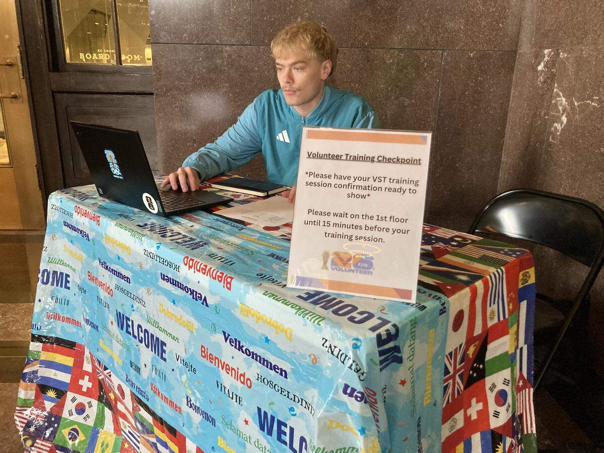 Cale Johnson, a 2026 FIFA World Cup volunteer coordinator signed in volunteers for training sessions at Union Station on Tuesday.