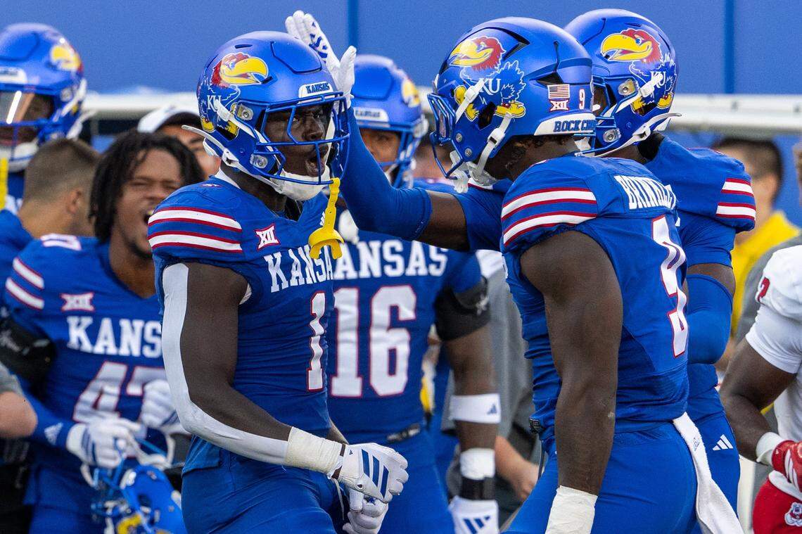 Kansas Jayhawks linebacker Bangally Kamara (1) gets a head tap from a teammate after making a tackle in the first half of the game vs. the Fresno State Bulldogs on Saturday, Aug. 23, 2025, at David Booth Kansas Memorial Stadium in Lawrence.