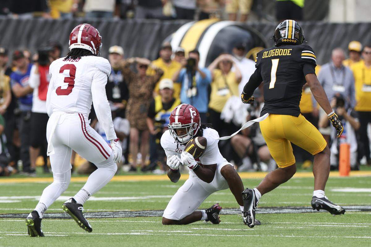 Alabama Crimson Tide defensive back Dijon Lee Jr. (5) intercepts a pass intended for Missouri Tigers wide receiver Donovan Olugbode (1) during the fourth quarter at Faurot Field at Memorial Stadium on Oct. 11, 2025.