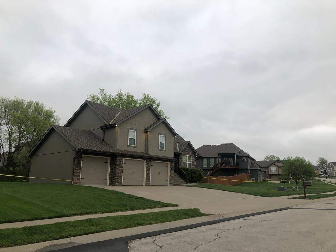 Crime scene tape remained around a home near Northwest 132nd Street and Running Horse Road after a police shooting in Platte County in May.