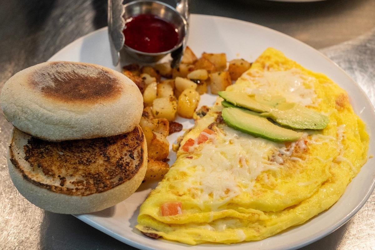 HomeGrown’s West Coast Wake Up omelet comes with rosemary potatoes, an English muffin and a house-made berry sauce.