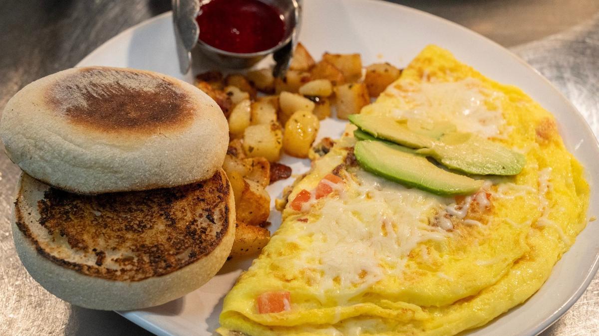 HomeGrown’s West Coast Wake Up omelet comes with rosemary potatoes, an English muffin and a house-made berry sauce.