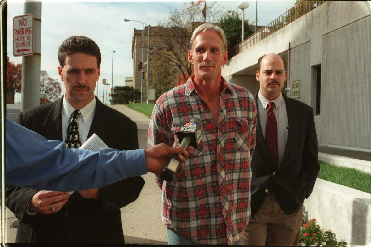 In 1998, Wesley Ira Purkey (center) was arrested in connection with the death of 80-year-old Mary Ruth Bales. Years later, in prison, he confessed to the murder of Jennifer Long.