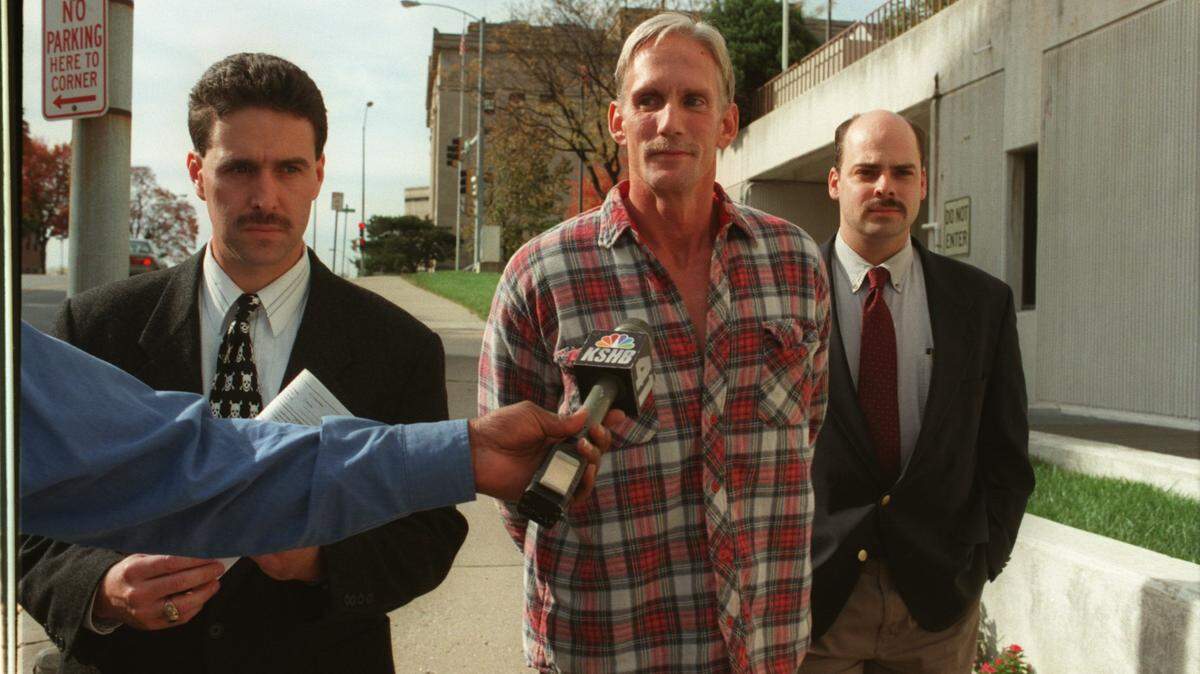 In 1998, Wesley Ira Purkey (center) was arrested in connection with the death of 80-year-old Mary Ruth Bales. Years later, in prison, he confessed to the murder of Jennifer Long.