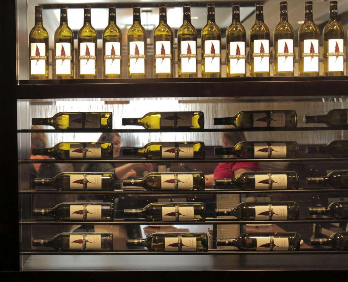 A Cooper’s Hawk wine section is shown here. The upscale food spot pairs its scratch-made food with award-winning wines.