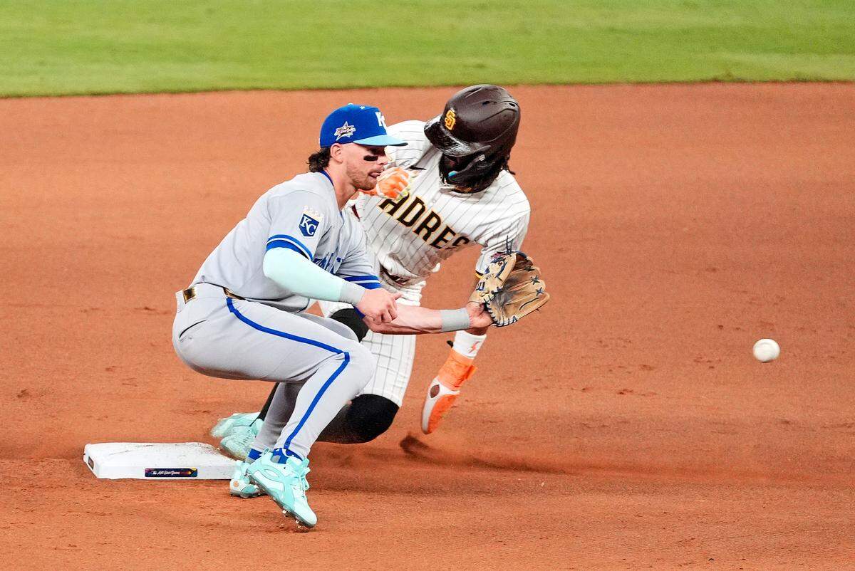 National League outfielder Fernando Tatis Jr. of the San Diego Padres steals second base as Kansas City Royals shortstop Bobby Witt Jr. awaits the throw during the sixth inning of the 2025 MLB All-Star Game at Truist Park in Atlanta on Tuesday, July 15, 2025.