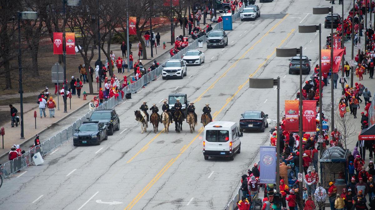 Mounted patrol officers ride down Grand Boulevard Wednesday morning before the start of the Kansas City Chiefs Super Bowl victory parade.