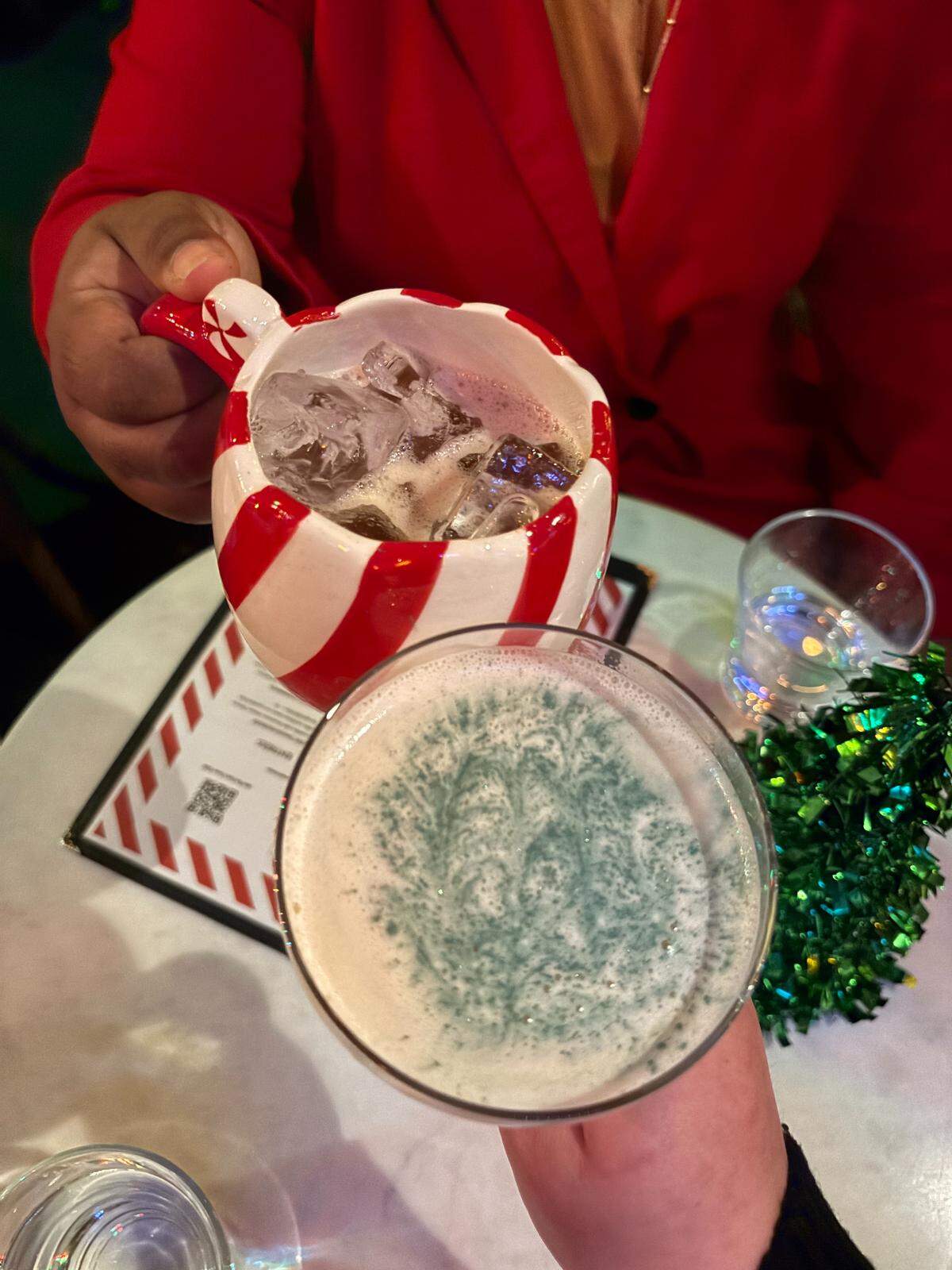 The Tom’s Town holiday menu has 15 cocktails, including Santa’s Cookies (bottom) and Angry Elf.
