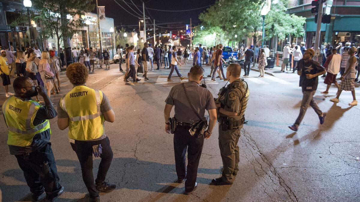 A combination of Westport Public Safety officers, Kansas City Police officers and Jackson County Sheriff's deputies monitored the crowd during what Kansas City police described as a typical Saturday night on Sunday, July 30, 2017, in Kansas City, Missouri. Jackson County prosecutors have charged Davontae McCutchen, 24, and Anthony Boykin, 26, after a Westport shooting on Sunday.