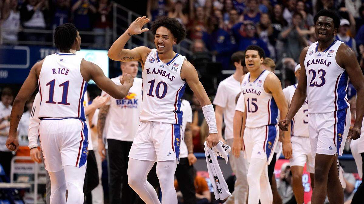Kansas players celebrate after a basket during the first half of Monday’s game against Texas on Feb. 6, 2023, at Allen Fieldhouse.