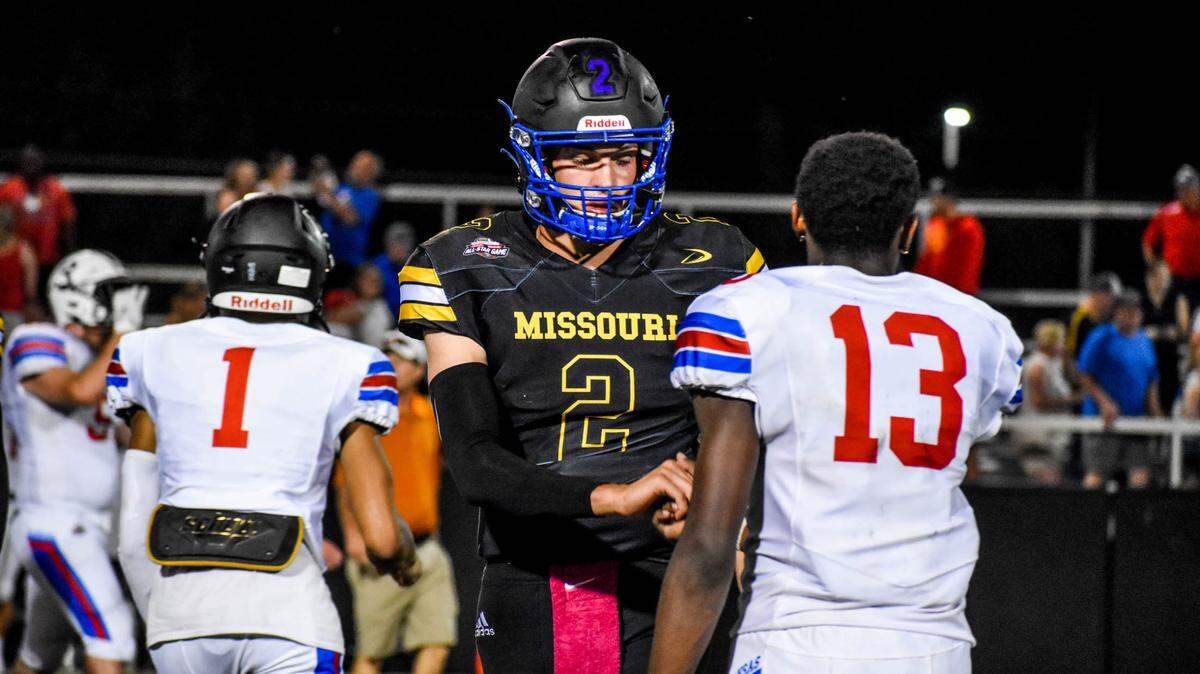 Cole Keller (left) and Malik Benson shake hands after the high school all-star game on Thursday, June 10, 2021.