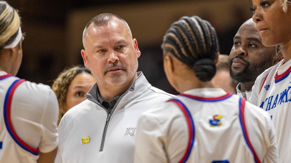 Kansas women’s basketball coach Brandon Schneider talks to players during a timeout in the third quarter of the Women’s Big 12 Conference Tournament against TCU on Thursday, March 9, 2023, at Municipal Auditorium in Kansas City.