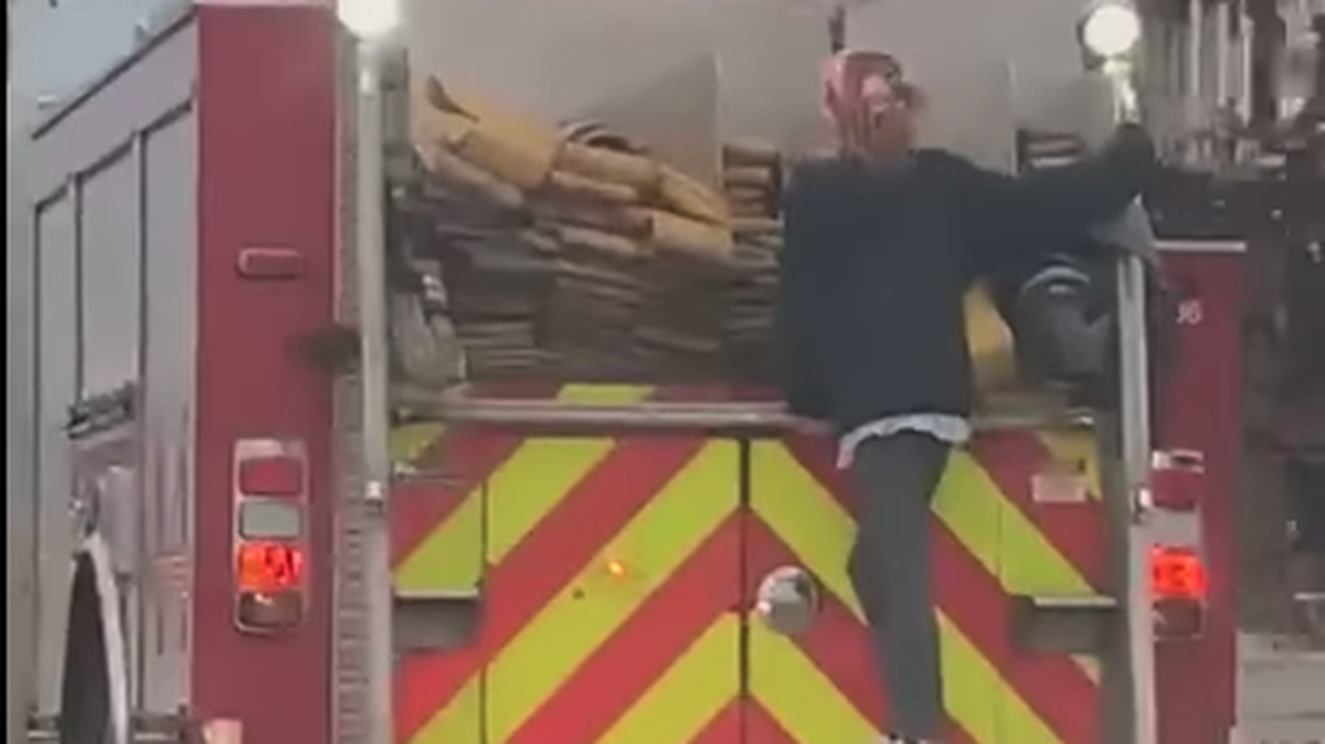 A woman hitched a ride on an Indianapolis Fire Department truck Tuesday.