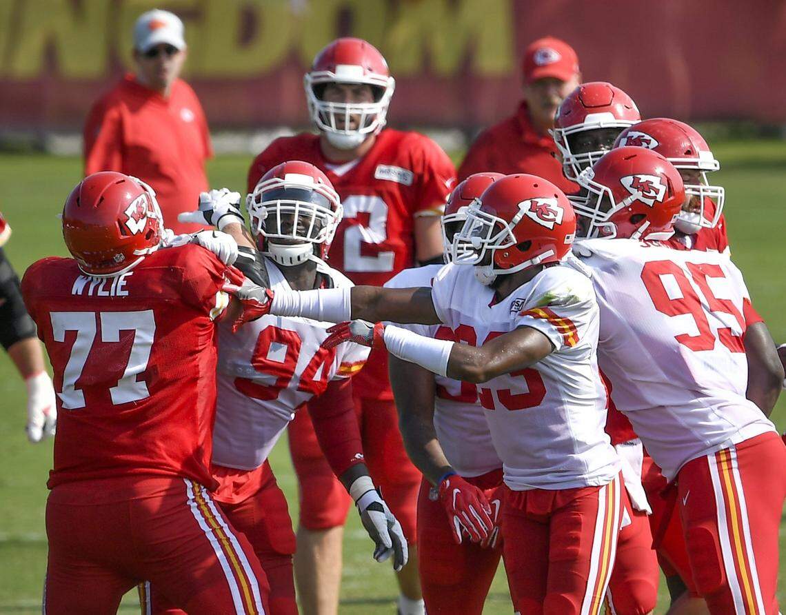 Cornerback Kendall Fuller, 23, defensive tackle Chris Jones, 95, and defensive back Leon III McQuay, 34, tried to calm everyone as things got a little heated between Kansas offensive tackle Andrew Wylie, 77, and defensive tackle Jarvis Jenkins, 94, following a running play by running back Spencer Ware during camp in 2018.