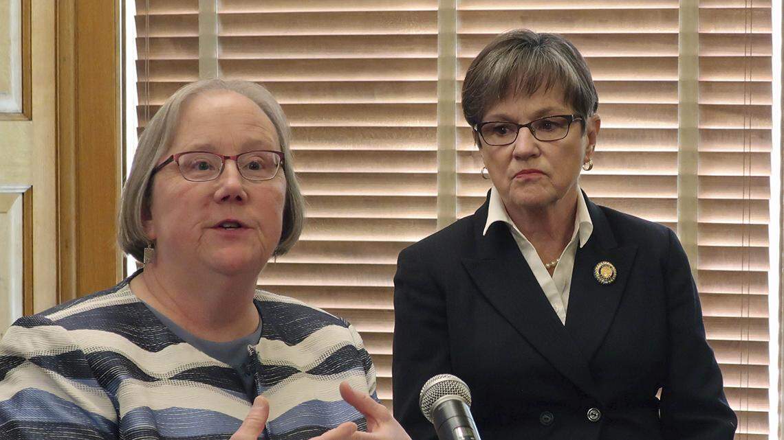 In this 2020 file photo, Laura Howard, left, the top social services administrator in Kansas, and Gov. Laura Kelly meet with reporters. In an agreement announced Tuesday, Howard, secretary for both the Department for Children and Families and the Department for Aging and Disability Services, agreed to a series of reforms in the treatment of mentally ill Kansans residing in state-funded Nursing Facilities for Mental Health (NFMH).(AP Photo/John Hanna)