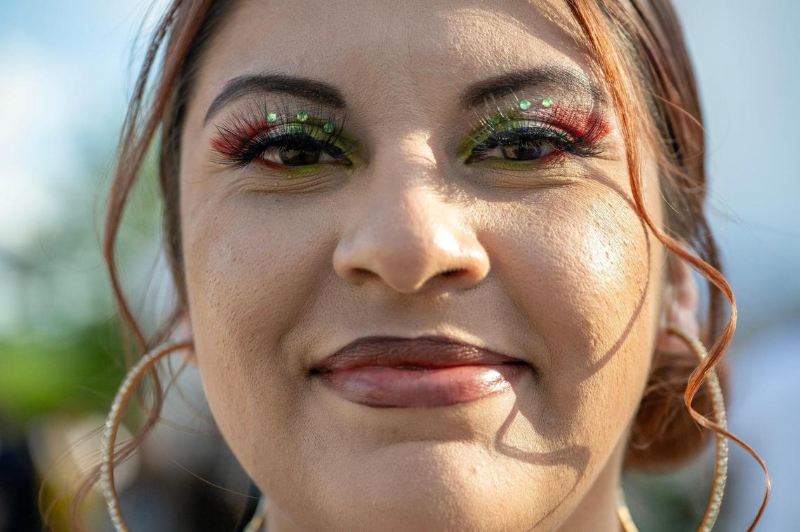Dively Castillo showcases her Mexican flag-themed eye makeup during the Cinco de Mayo Festival in Kansas City’s Westside neighborhood.