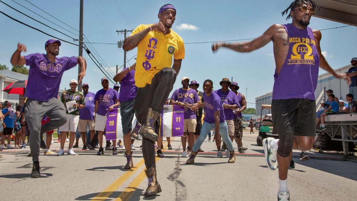 Members of the Omega Psi Phi fraternity performed a step routine in front of the judges stand at the JuneteenthKC 2021 Cultural Parade Saturday, June 12, 2021 in the Historic Jazz District near 18th and Vine.