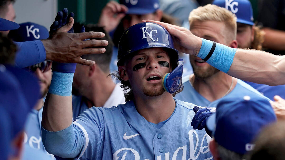 Kansas City Royals’ Bobby Witt Jr. celebrates in the dugout after hitting a solo home run during the third inning of a baseball game against the Oakland Athletics Saturday, June 25, 2022, in Kansas City, Mo. (AP Photo/Charlie Riedel)