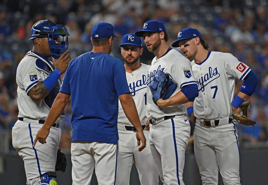 Kansas City Royals starting pitcher Alec Marsh (48) talks with Kansas City Royals pitching coach Brian Sweeney (left) in the third inning against the Detroit Tigers at Kauffman Stadium on Sept. 18, 2024.