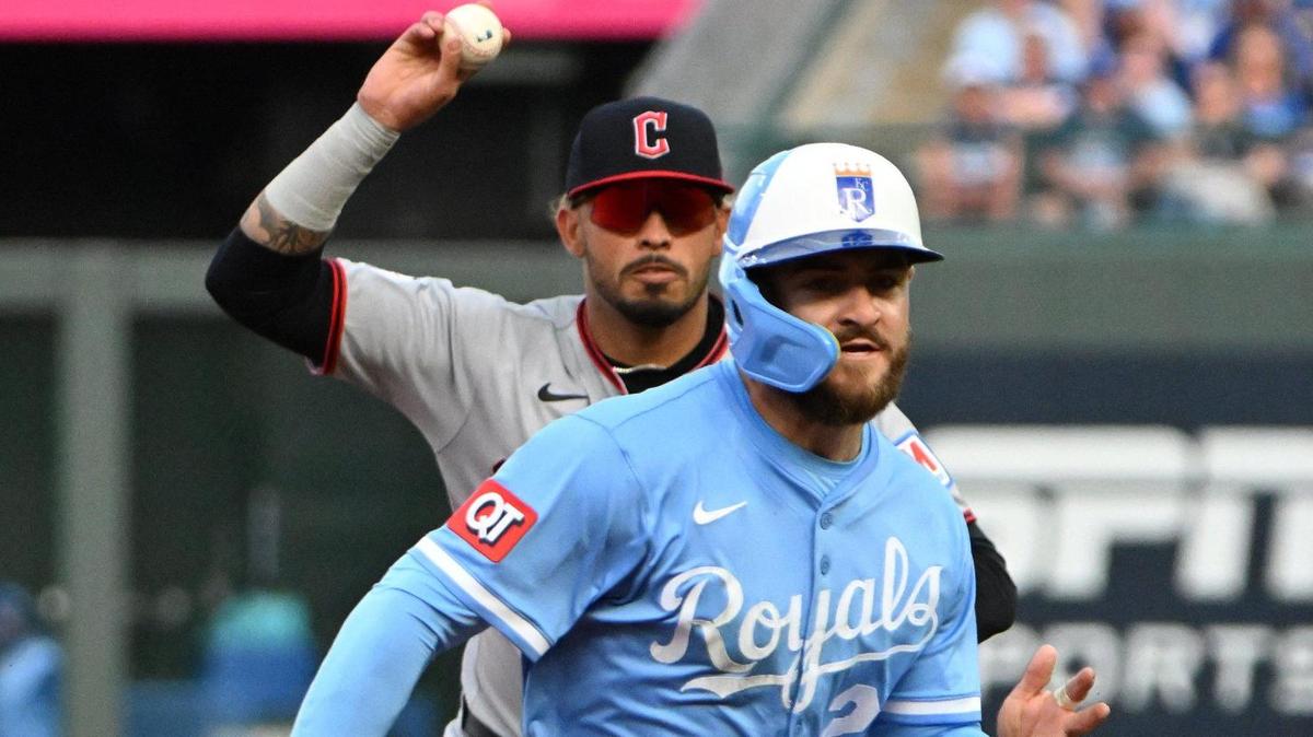 Cleveland Guardians shortstop Brayan Rocchio (4) chases Kansas City Royals outfielder Kyle Isbel (28) in a rundown between 2nd and 3rd base in the 8th inning during the opening day game Thursday, March 27, 2025, at Kauffman Stadium.