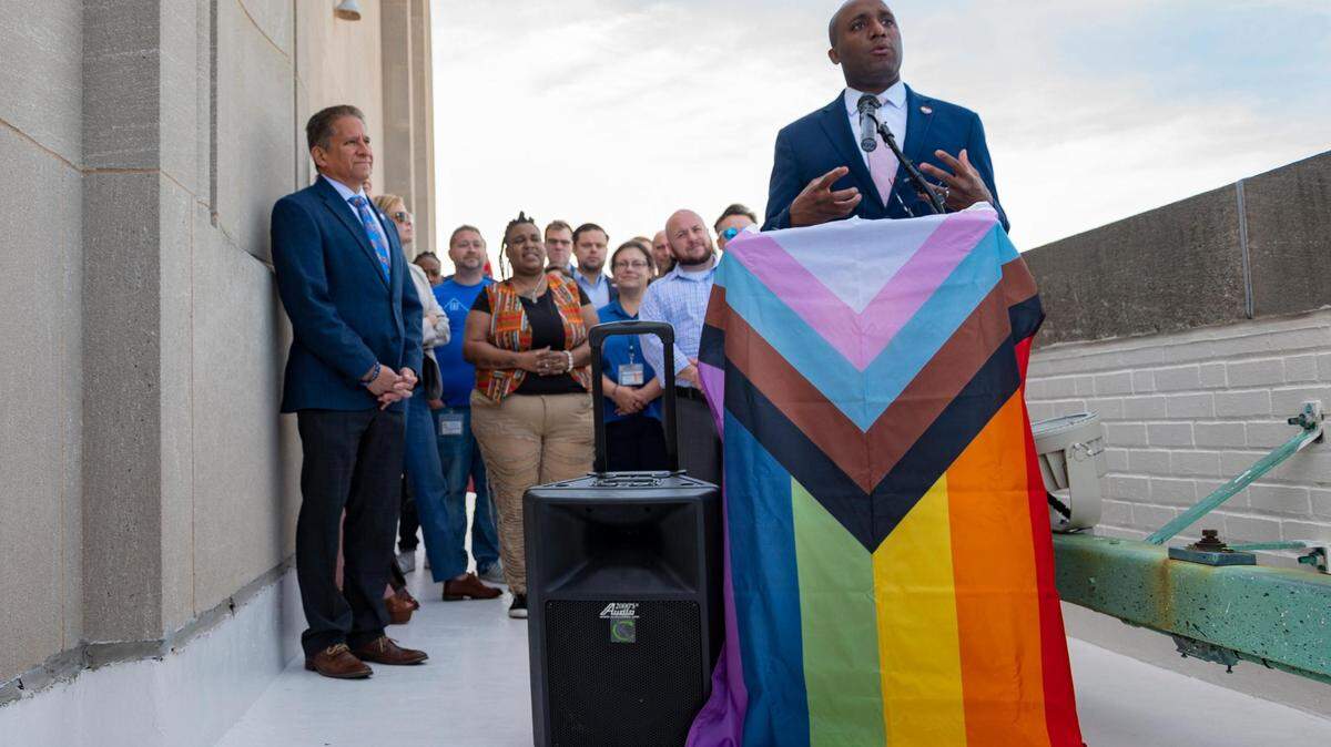 Mayor Quinton Lucas shares remarks about the city’s human rights initiatives as city workers gather to watch the Pride flag be raised on the City Hall flagpole in Kansas City on June 2, 2022.