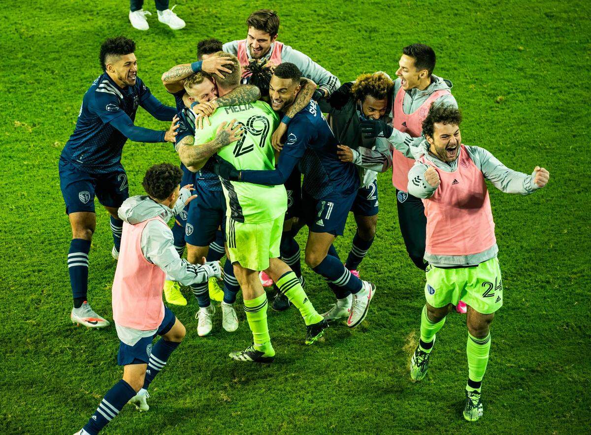 Sporting Kansas City goalkeeper Tim Melia (29) is congratulated by teammates after shutting out the San Jose Earthquakes during a penalty kick shootout at Children’s Mercy Park on Nov. 22, 2020.