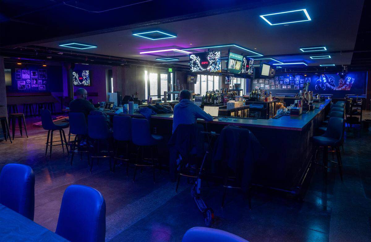 The bat at Ricochet, an adult game lounge, awaits visitors at the new spot on McGee Street.