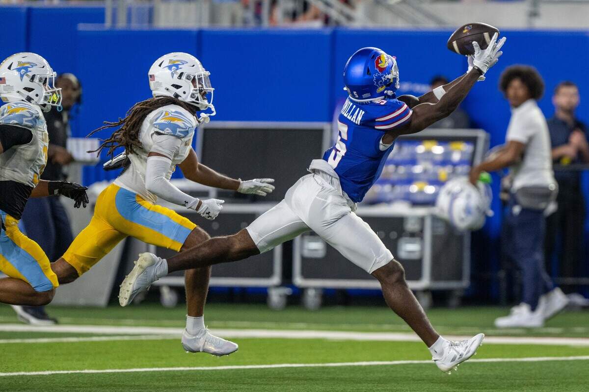 Kansas Jayhawks wide receiver Nik McMillan (5) stretches out for a catch in the second half of the Jayhawks game vs. Long Island University Sharks at David Booth Memorial Stadium on Friday, September 4, 2026, in Lawrence.