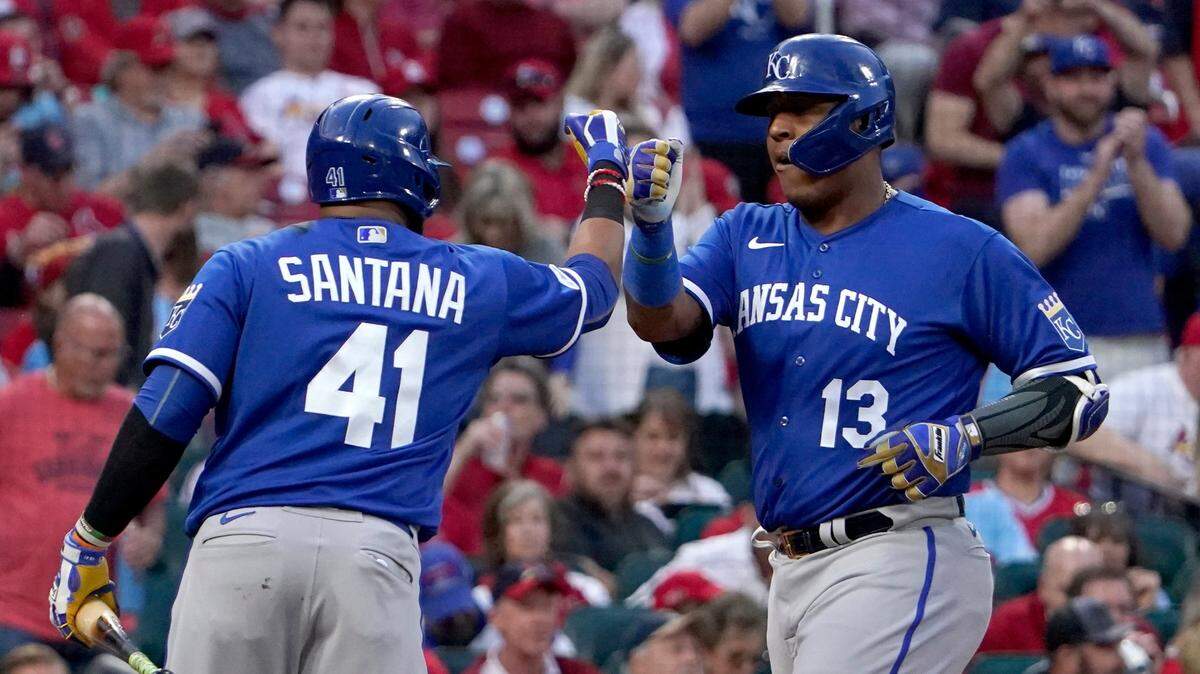 Kansas City Royals catcher Salvador Perez, right, is greeted at the plate by teammate Carlos Santana after rounding the bases following one of his two home runs on Tuesday against the Cardinals in St. Louis.