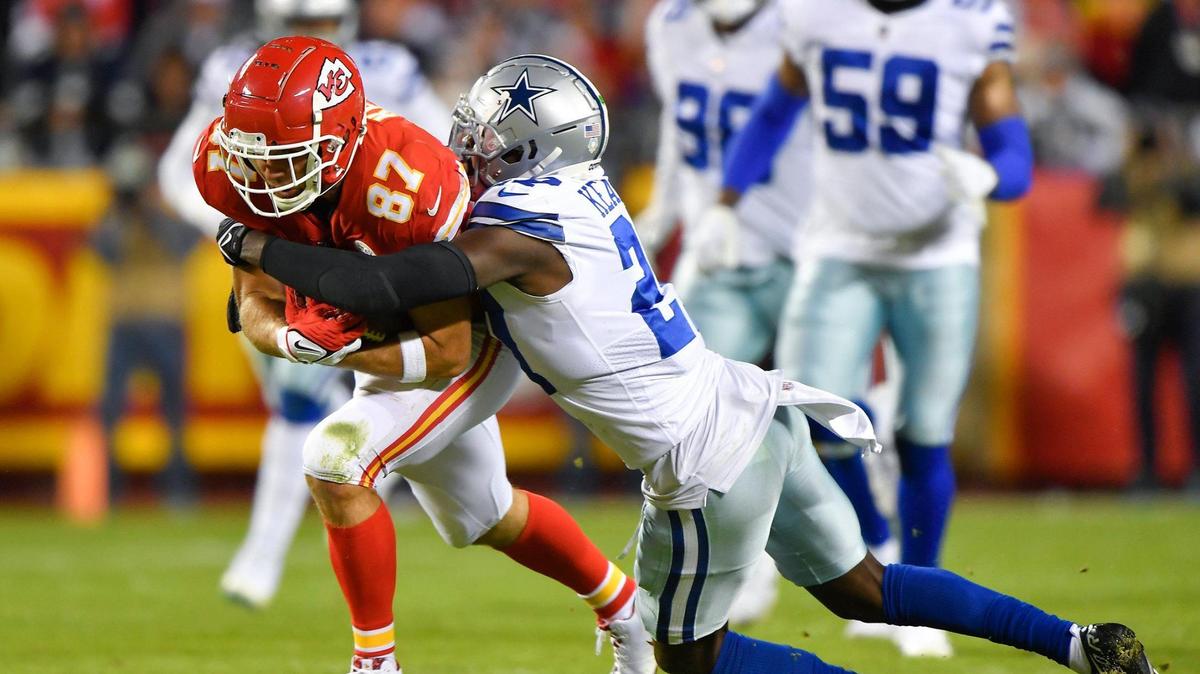 Dallas Cowboys safety Jayron Kearse (27) tackles Kansas City Chiefs tight end Travis Kelce who ran for a first down during the first-half of the Dallas-Kansas City game on Sunday, Nov. 21, 2021 at Arrowhead Stadium in Kansas City.